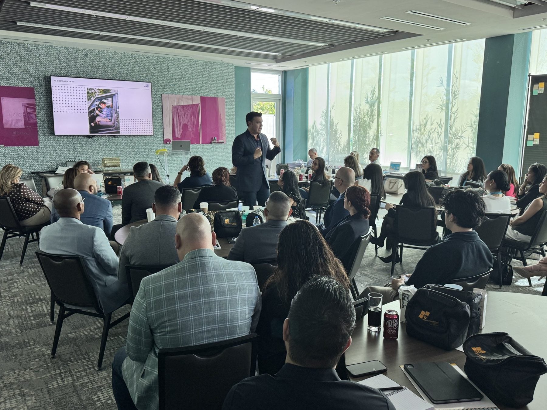 Alberto Sardiñas leading a working session with a room of managers